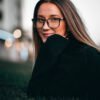 Comparison of a woman wearing glasses before and after applying a preset