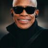 A comparison of an older gentleman's smile before and after applying a preset