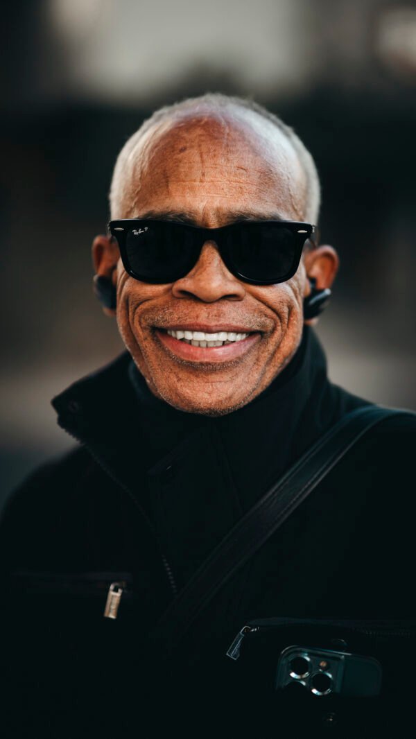 A comparison of an older gentleman's smile before and after applying a preset
