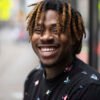 Side-by-side comparison showing a man with a neutral expression before and beaming with a bright smile after the Jake Chappell preset is applied.