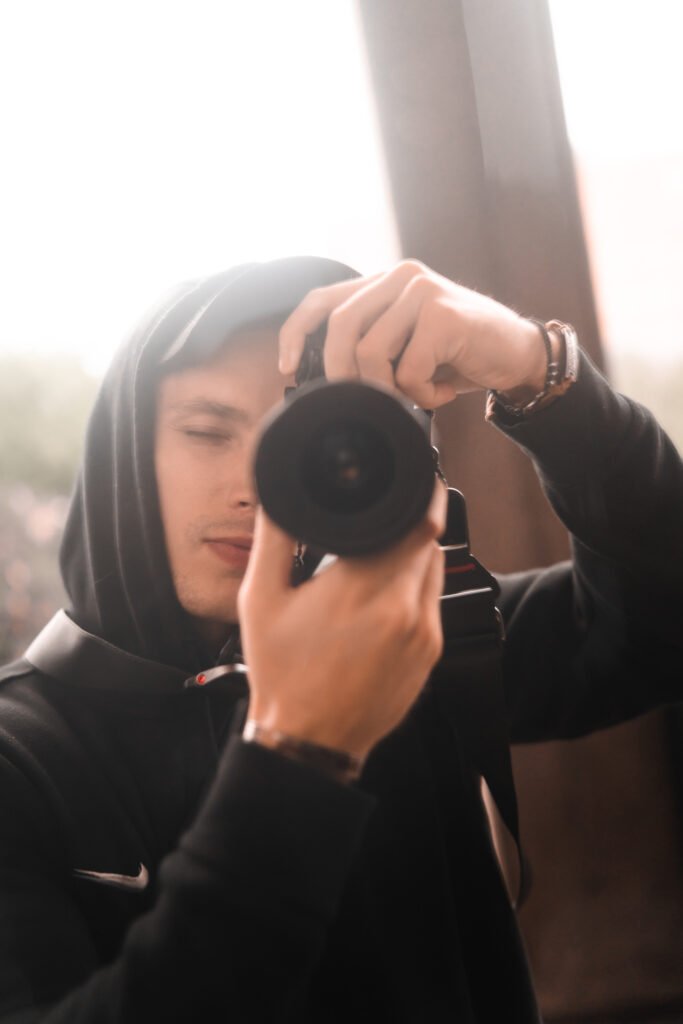 Image of Jake Chappell looking through a camera lens